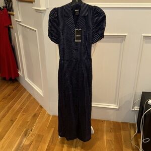 Navy pinstriped dress it's long it has a tie in the back and pockets!!